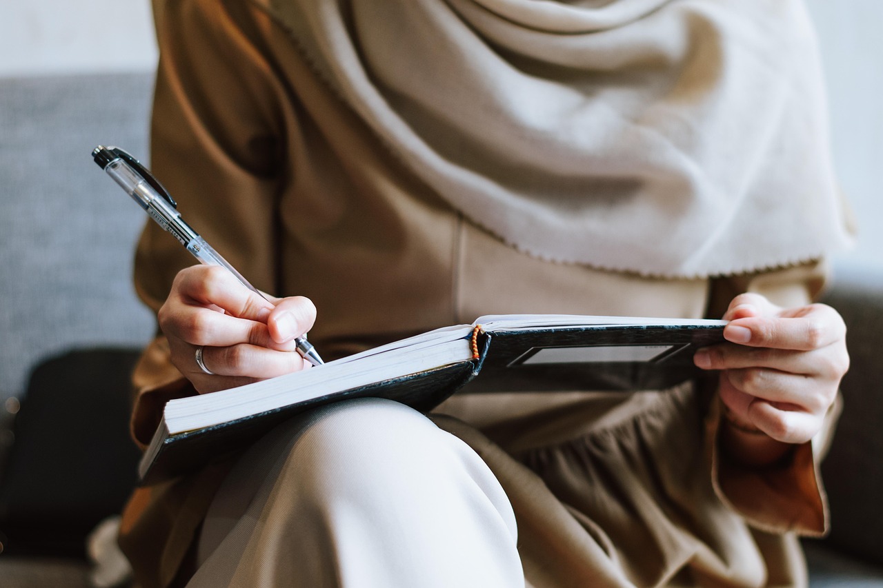 Muslim, woman, writing — Boosted Reels, Boosted Presence: Enhancing Your Instagram with More Likes